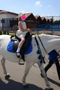 Anthoula on a Horse Back Celebrating her seventh Birthday 2019.06